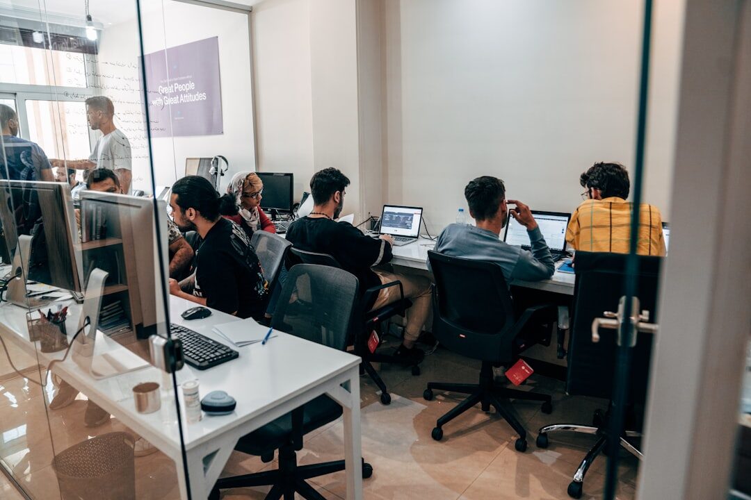 Team of media professionals working together in a bright office